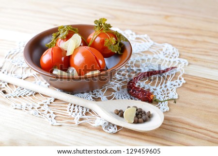 Traditional ukrainian cuisine - marinated tomatoes. Homemade preserves. Canned tomatoes.