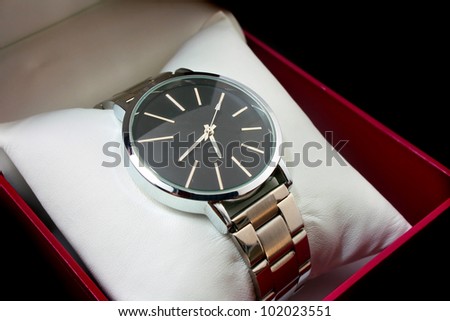 watch in gift box isolated on black