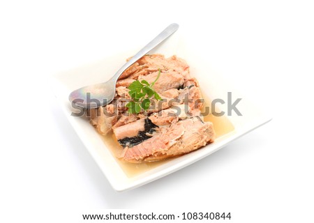 Tin Food Pink Salmon with spoon isolated on white background