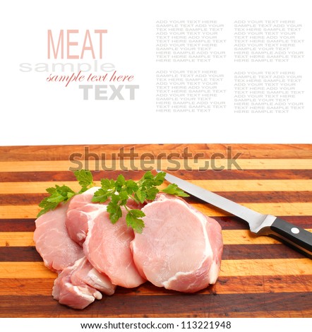 Pork Loin Steaks on the chopping board with knife isolated on white