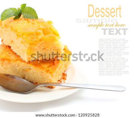 Slice of Home made pineapple upside down cake isolated on white