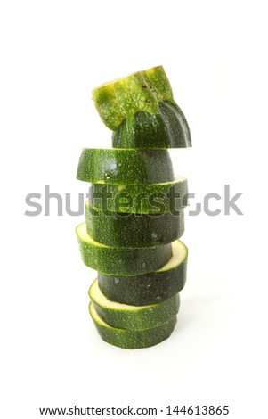 Stack of Fresh cut Zucchini isolated on white