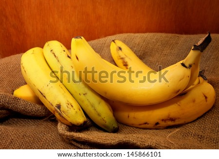 Banana with Gunny Bag and wooden background