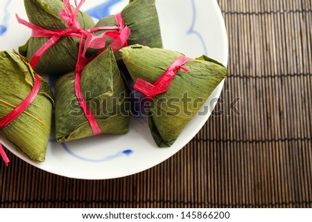 Chinese Rice Dumplings on bamboo mat