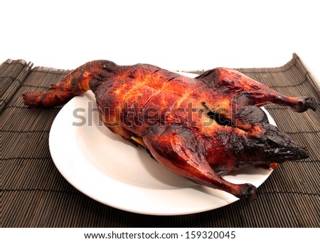 Chinese Style of Roast Duck on bamboo table mat