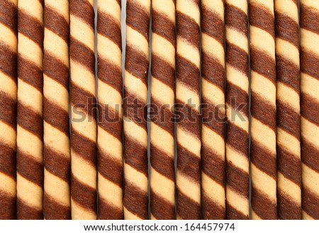 Striped wafer rolls filled with chocolate texture