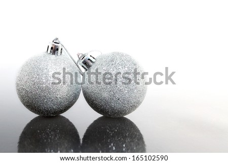 silver Christmas ball on grey and white background