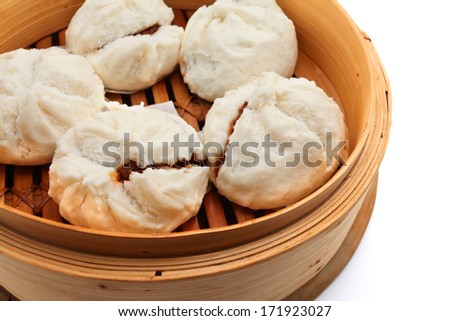 Char Siu Bao - Chinese steamed bun filled with bbq pork isolated on white