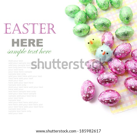 Easter chocolate eggs with little Easter chicken isolated on white