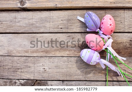Purple and Pink Plastic Easter Egg over wooden or timber background