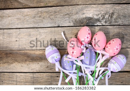 Purple and Pink Plastic Easter Egg over wooden or timber background