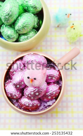 Colorful Easter chocolate eggs with little Easter chicken