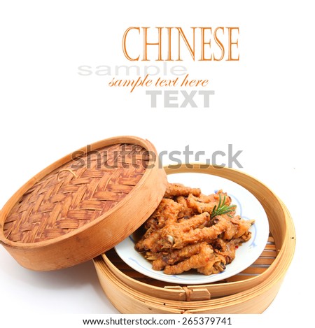 Chinese Cooked Chicken Feet in bamboo steamer on white