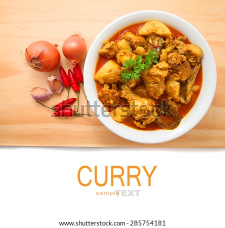 Curry Chicken with ingredients on the wooden table with copy space