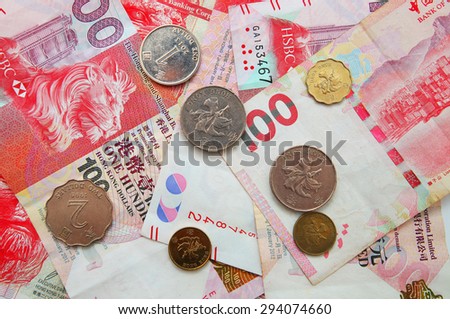 Hong Kong dollar money banknote with coins