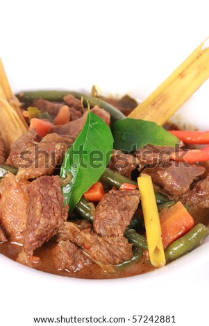 Curry Beef with curry leaf isolated on white