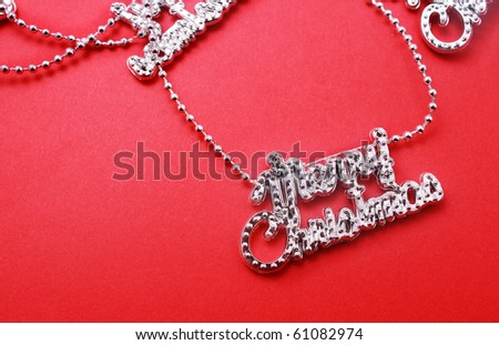 Silver christmas letter Garland chain  isolated on red