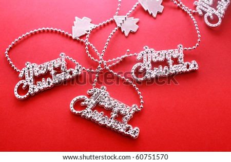 Silver christmas letter Garland chain  isolated on red