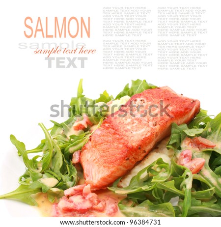 Fried Salmon Steak with baby rocket salad isolated on white