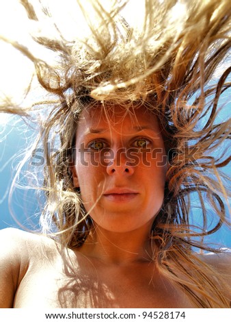 Portrait of Young Woman with Crazy Falling Hair / Funny woman