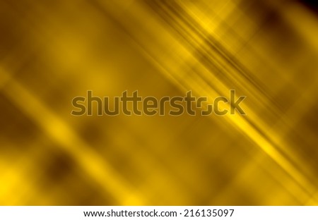 An abstract golden yellow background with a pattern of diagonal blurred lines and spots. Can be used as a wallpaper.