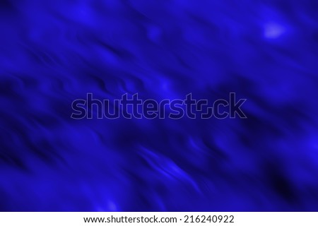 An abstract dark cold blue background with a pattern of diagonal curves, waves and spots. Can be used as a wallpaper.