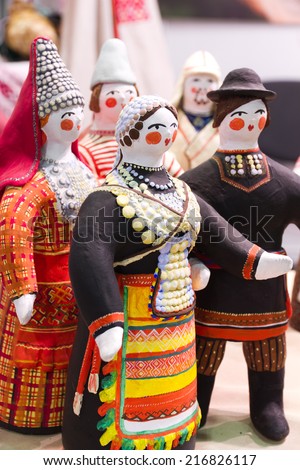 Handmade dolls (couple - man and woman) of clay symbolizing the love dressed in traditional national russian clothes. Shot was done at the flea market in Moscow (Russia).