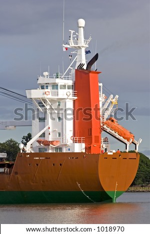 Rear of Cargo Ship showing lifeboat and emergency escape vessel on launcher