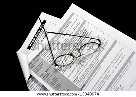 Close up of Real Estate contract with reading glasses