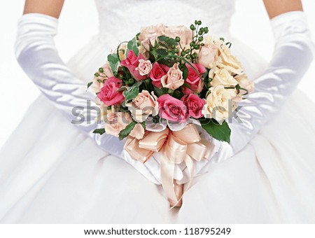 Bride holding wedding flower bouquet