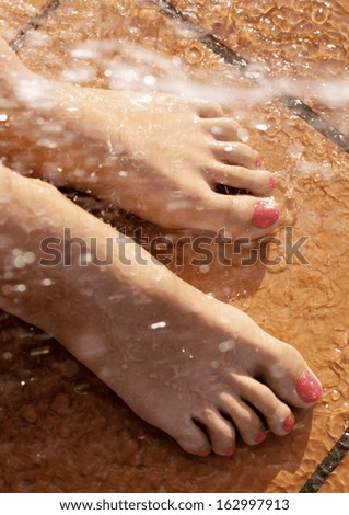 woman massage feet in water