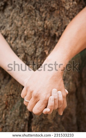 2 friends holding hands