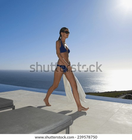 Happy female in bikini in pool
