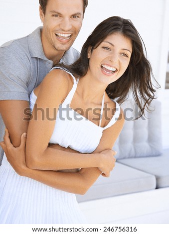 Cheerful trendy couple having fun