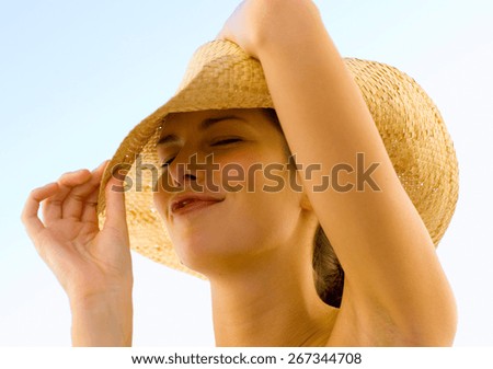 Beautiful woman with hat smiling