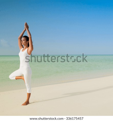 yoga beach woman doing pose