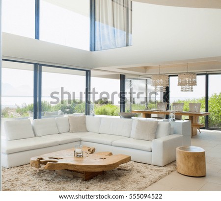 Sunny living room interior with a comfortable sofa. Sofa of tissue in a modern living room. Modern living room interior. Architecture, Interior, modern apartment, wide living room