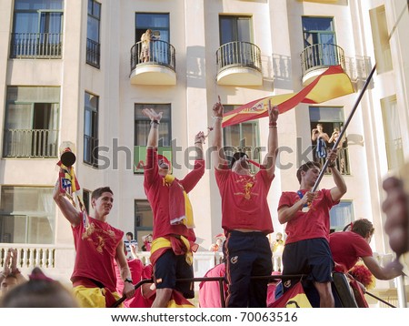 MADRID, SPAIN - JULY 12: Spanish soccer selection team celebrates the won World Cup of South Africa 2010 on July 12, 2010 at Madrid. Players Torres, Ramos and Reina with the cup the day after succes.