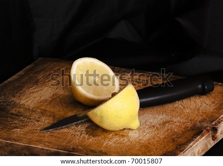 Lemon cut by a knife.