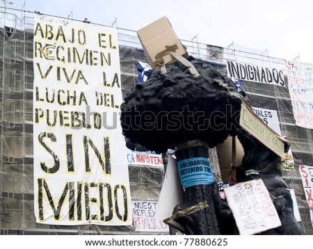 MADRID; SPAIN - MAY 22: Popular demonstration against political class on May 22, 2011 in Madrid; Spain. Protest signs at the Spanish Revolution.
