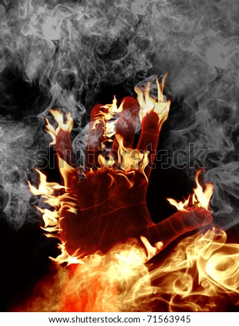 male hand is on fire, smoke in the background