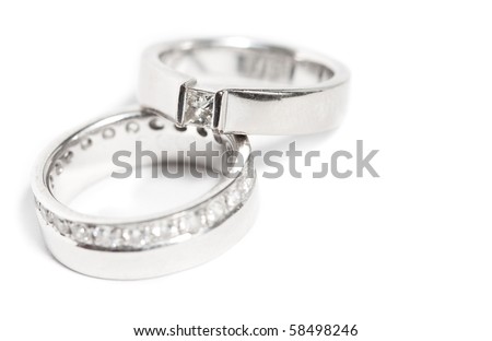 stock photo Diamond wedding rings on white background