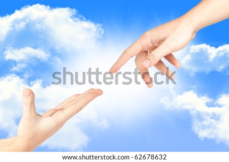Hand reaching out from the sky