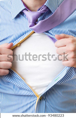 Close-up of man opening his shirt to reveal blank white shirt like superman