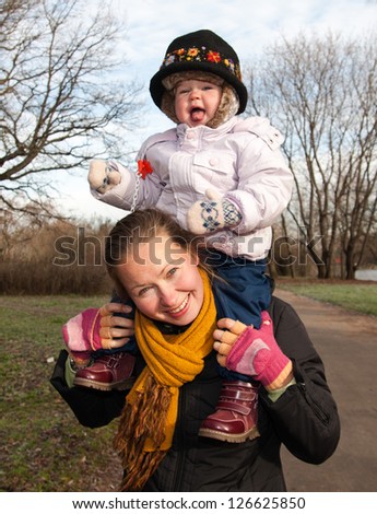 Portrait of Happy Mother and Daughter In Garden / Happy Mother and Daughter