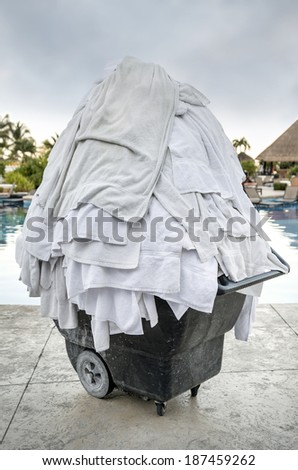 White towel heap  Big laundry to made in hotels where swimming pools are found.