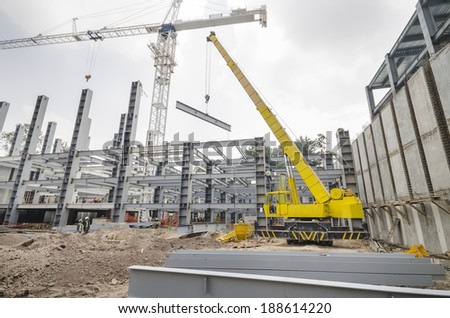 MEXICO CITY, MEXICO- OCTOBER 06: Image of a big crane elevating a steel beam to help create the structural body of a this new building site in Mexico city as seen in October 06, 2011