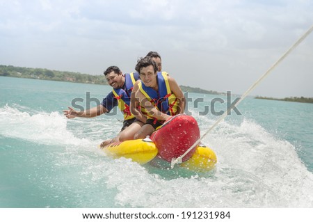Exciting banana surf ride Surfing along the waves can be a real challenge not to fall off to the water