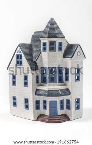 Ceramic house model Blue painted house symbolizing our need to be at home
