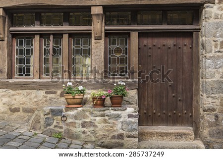 French medieval construction \
Colorful arquitectural details of medieval door and windows in Brittany, France